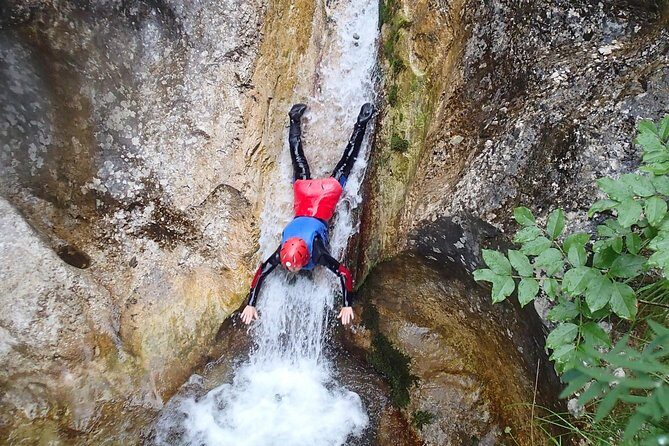 CANYONING in Susec from Bovec, Families welcome, photo service - What you actually do in Susec: hikes, toboggan-style slides, and waterfall moments