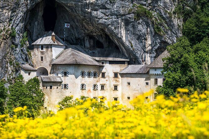 Ljubljana: Postojna cave & Predjama castle small group tour - Stop 1: Predjama Castle on the cliff and the stair-and-tunnel vibe