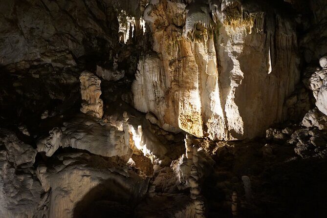Postojna cave and Predjama castle Tour from Ljubljana - Predjama Castle on a Cliff: Audio Pace and Medieval Drama